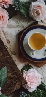 Vintage floral wallpaper with roses and a teacup.