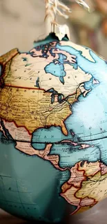 Vintage-style globe map displaying North America and beyond.