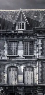 Vintage gothic house in dark tones on mobile wallpaper.