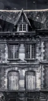 Vintage Gothic house in grayscale wallpaper with intricate architectural details.