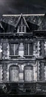 Eerie vintage mansion with gothic architecture, gray tones, and dark atmosphere.