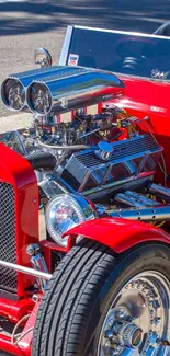 Vivid red vintage hot rod with chrome engine details.