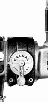 Artistic grayscale image of a vintage industrial machine.