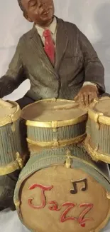 Vintage sculpture of a jazz drummer with brown suit.