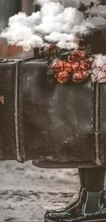 Vintage suitcase with flowers at train station.