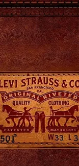 Vintage Levi Strauss leather jeans label wallpaper with brown tones.