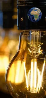 Close-up of a glowing vintage light bulb with an Earth motif on top, exuding warmth.