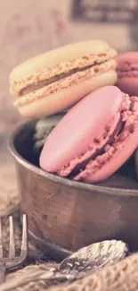 Rustic bowl of pastel-colored macarons in a soft vintage setting.