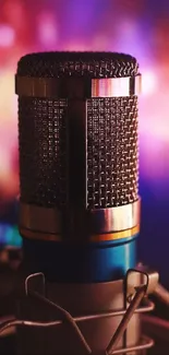 Vintage microphone with blurred purple background.