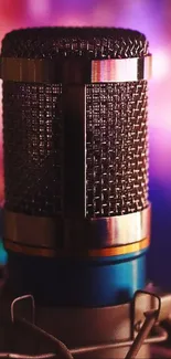 Vintage microphone with colorful bokeh background.