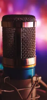 Close-up of a vintage microphone with a colorful blurred background