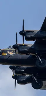 WWII vintage military aircraft flying in clear sky