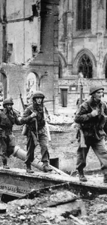 Vintage black and white photo of soldiers marching through ruins.