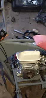 Vintage mini bike in a mechanic's workshop with tools.