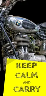 Vintage motorcycle with 'Keep Calm and Carry On' sign on a black background.