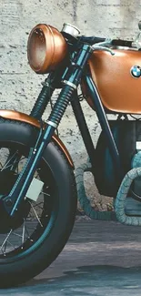 Vintage brown motorcycle against a rustic wall.