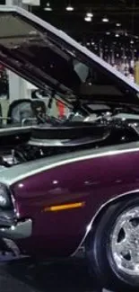 Purple vintage muscle car in auto exhibition showcase.