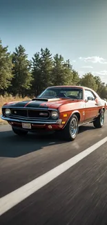 Vintage muscle car on scenic road with trees under clear sky.