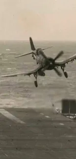 Vintage navy plane takes off from flight deck over the ocean.