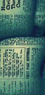 Vintage newspaper print on teal background wallpaper.