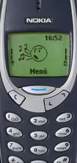 Vintage Nokia phone with classic keypad and green screen display.