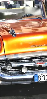 Vibrant vintage orange car wallpaper