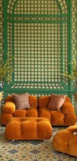 Vintage living room with orange sofas and green lattice walls.