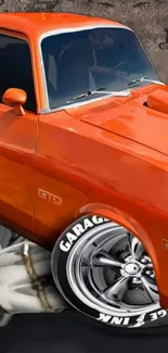 Orange vintage muscle car with chrome wheels and a classic design.