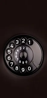 Vintage rotary phone dial on black background.