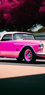 A vintage pink car with a vibrant backdrop, perfect for unique wallpapers.