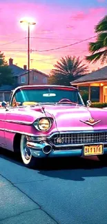 Vintage pink convertible car at sunset with palm trees and houses.