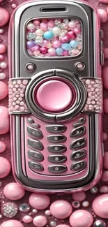 Vintage mobile phone with pink and pearl accents.