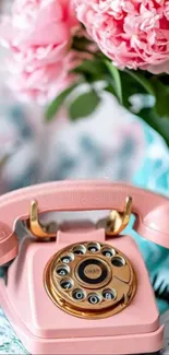 Pink rotary phone with floral backdrop, aesthetic wallpaper.