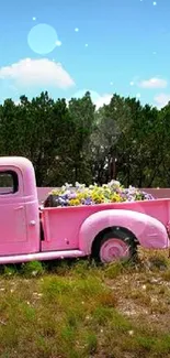 Vintage pink truck with flowers in nature.