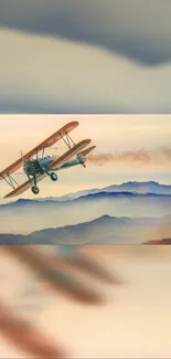 Vintage biplane flying over misty mountains at sunrise.