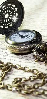 Antique bronze pocket watch with ornate chain on vintage background.