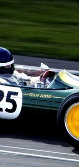 Vintage Lotus race car with number 25 on the track.