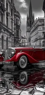 Vintage red car in a historic urban street setting.