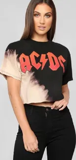 Fashionable woman in vintage rock band tee with black jeans.