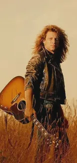 Rock musician in leather jacket with guitar in golden field.