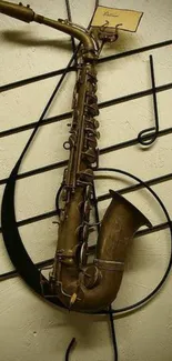 Vintage brass saxophone with musical notes on wall.