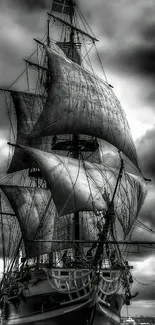 Black and white vintage ship with dramatic clouds.