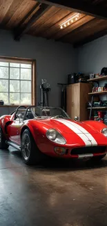 Red vintage sports car in a garage setting.