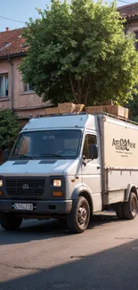 Vintage delivery truck on a rustic urban street.