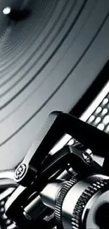 Close-up of a vintage turntable in black and white.