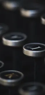 Close-up of vintage typewriter keys with a dark, retro aesthetic.