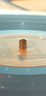 Golden spinning vinyl record on turntable with dreamy glow.