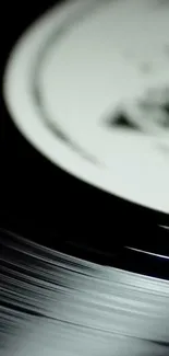 Close-up shot of a spinning vinyl record showcasing grooves.