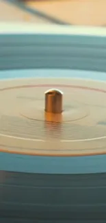 Close-up of a vintage vinyl record on a turntable, perfect for mobile wallpaper.