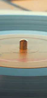 A spinning vinyl record with a beige label on a turntable.